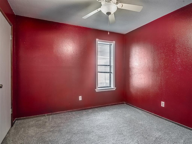 unfurnished room with carpet flooring and ceiling fan