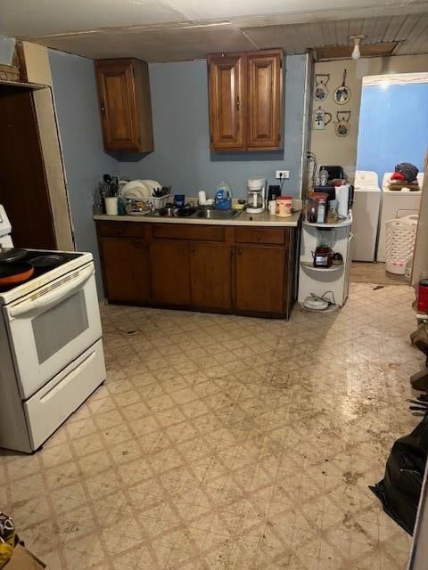 kitchen featuring sink and white electric range