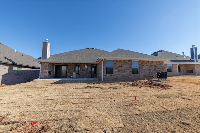 back of property with a patio and central air condition unit