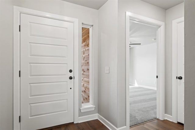 entrance foyer with dark hardwood / wood-style floors and ceiling fan