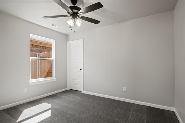 carpeted empty room featuring ceiling fan