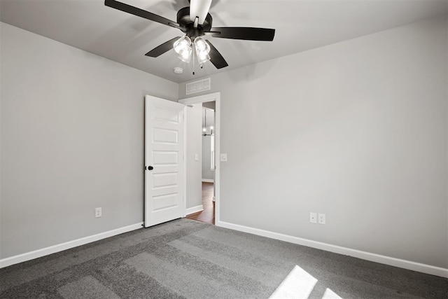 carpeted empty room with ceiling fan