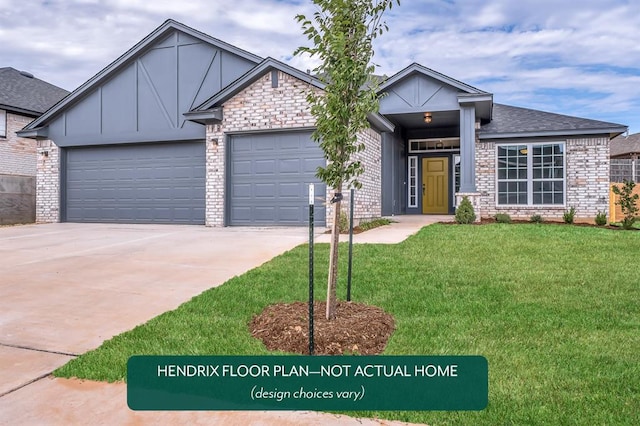 view of front of house featuring a front yard and a garage