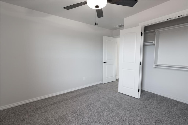 unfurnished bedroom with ceiling fan, a closet, and carpet floors