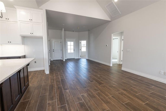 kitchen with white cabinets and vaulted ceiling