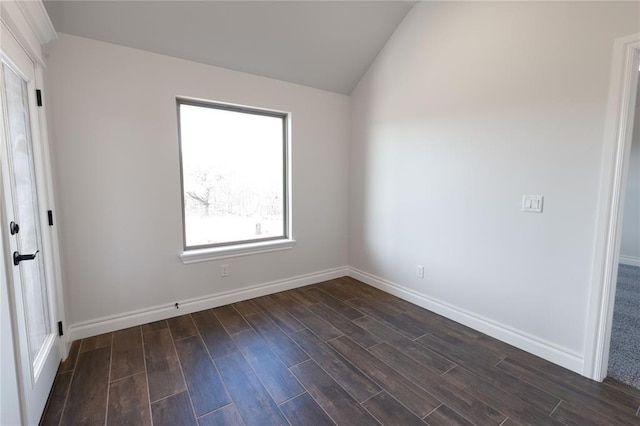 spare room with vaulted ceiling