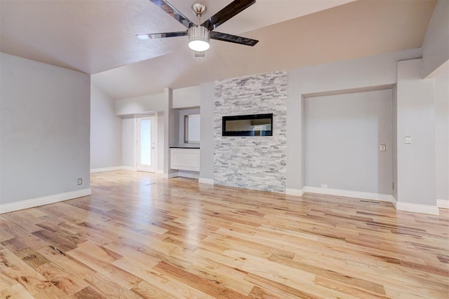 unfurnished living room with light hardwood / wood-style floors, ceiling fan, and lofted ceiling