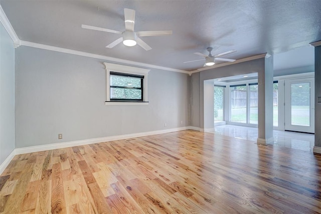 spare room featuring ceiling fan, light hardwood / wood-style flooring, and ornamental molding