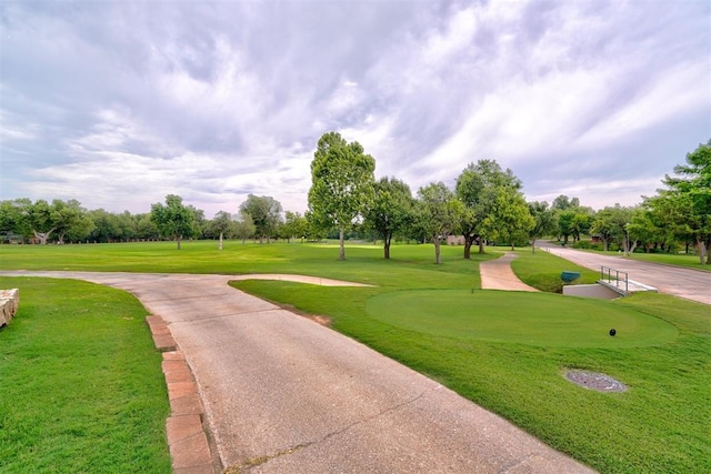 surrounding community featuring a yard