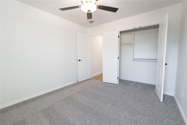 unfurnished bedroom featuring carpet floors, a closet, and ceiling fan