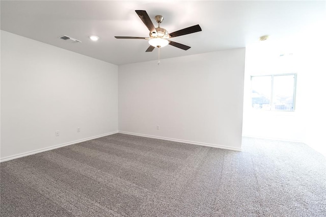 unfurnished room featuring ceiling fan and carpet flooring