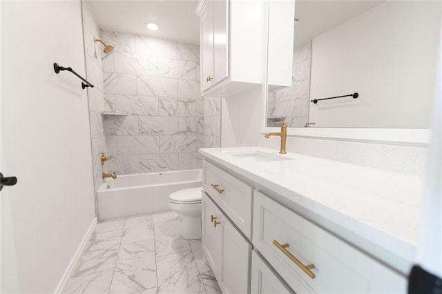 full bathroom featuring tiled shower / bath, vanity, and toilet