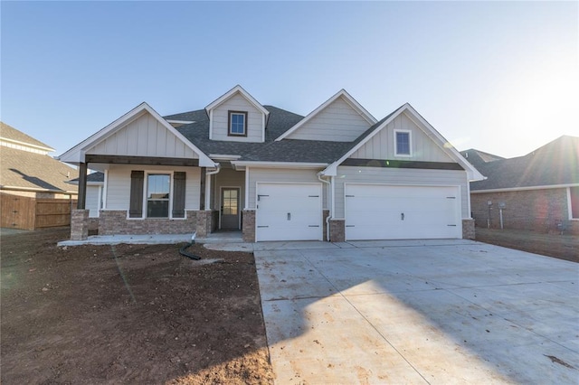 craftsman inspired home with a garage and a porch