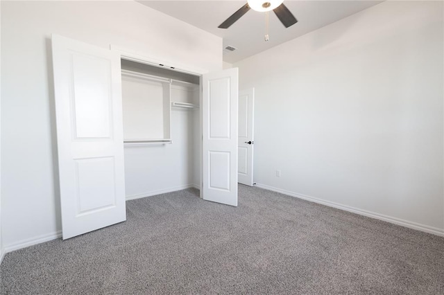 unfurnished bedroom featuring ceiling fan, a closet, and carpet