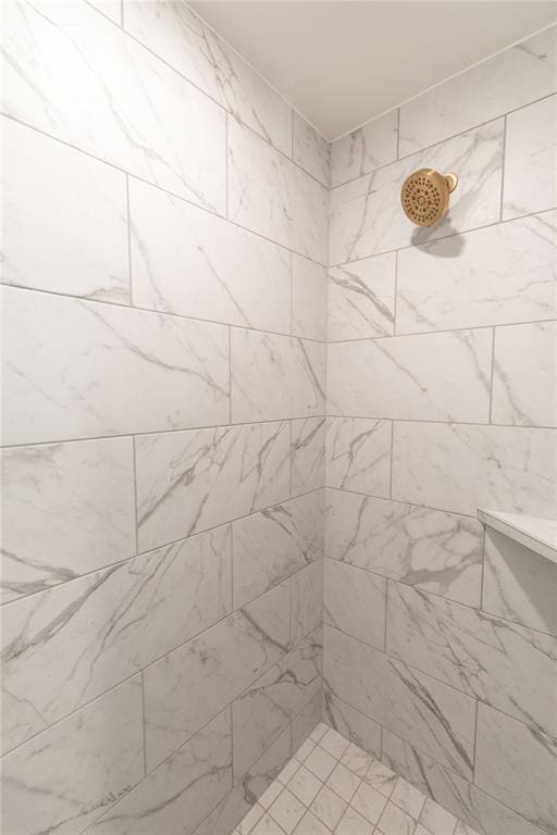 details with a tile shower