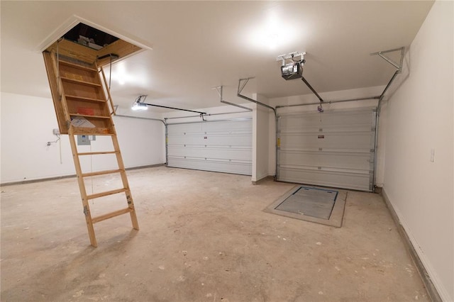 garage with baseboards and a garage door opener