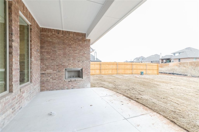 view of patio / terrace featuring fence