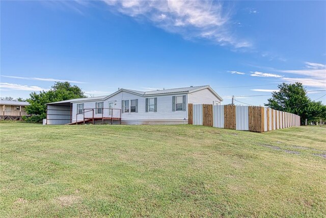 306 E Ninth St, Leedey, OK 73654 - rear view of property featuring a deck