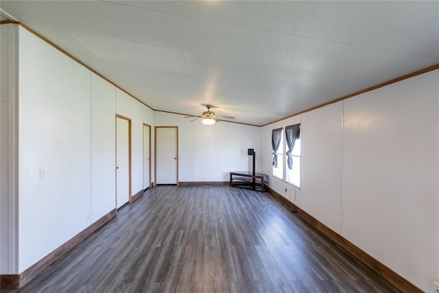 306 E Ninth St, Leedey, OK 73654 - unfurnished room with dark wood-type flooring, ornamental molding, and ceiling fan