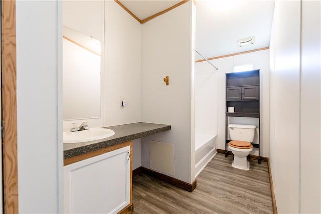 306 E Ninth St, Leedey, OK 73654 - full bath with vanity, wood finished floors, and shower / bath combination