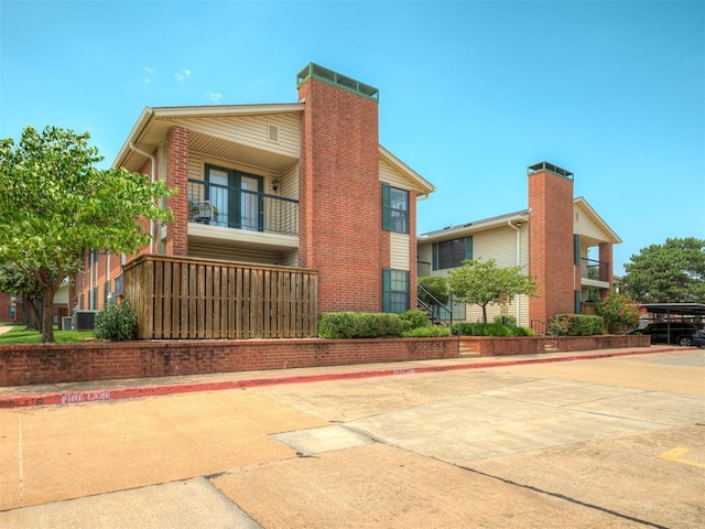 view of side of property featuring a balcony