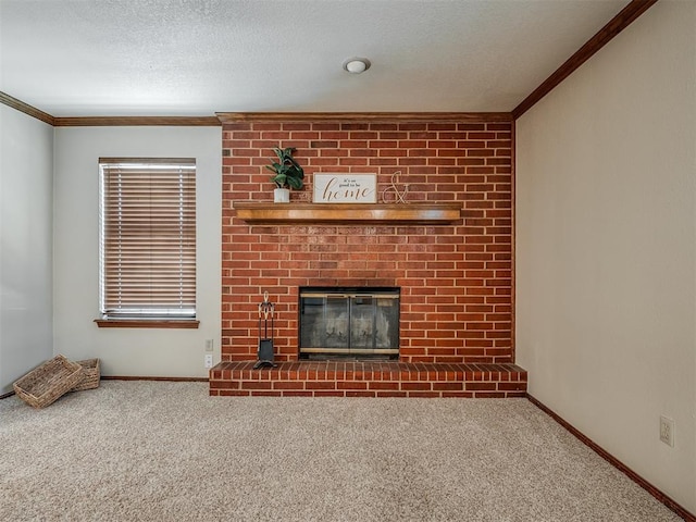 unfurnished living room with a fireplace, a textured ceiling, carpet floors, and crown molding