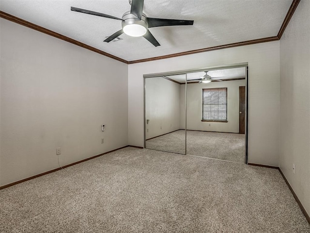 unfurnished bedroom featuring a closet, ceiling fan, and light colored carpet