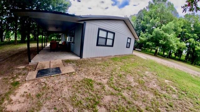 view of home's exterior with a carport