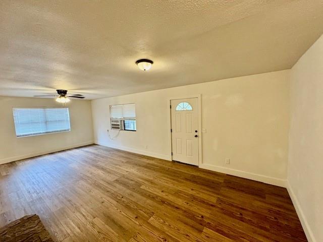 foyer entrance with hardwood / wood-style floors, a textured ceiling, and ceiling fan