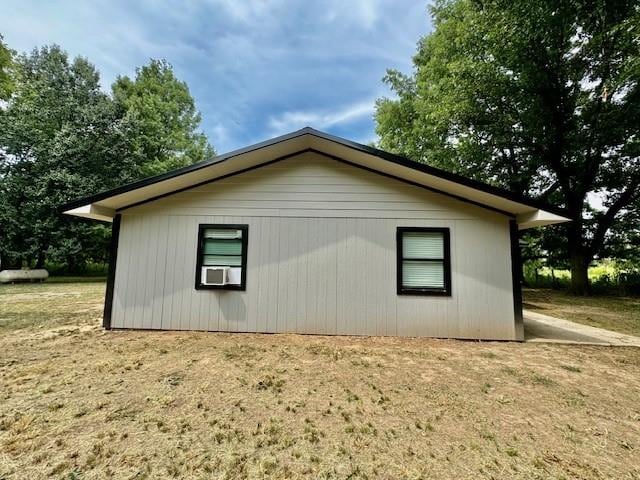 view of side of property with a yard