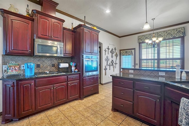21321 E 1290th Rd, Sentinel, OK 73664 - kitchen with pendant lighting, an inviting chandelier, crown molding, appliances with stainless steel finishes, and tasteful backsplash