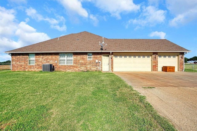 21321 E 1290th Rd, Sentinel, OK 73664 - view of front of home featuring central AC unit, a garage, and a front yard