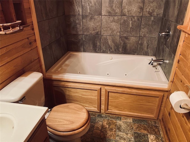 bathroom with wooden walls, a bath, and toilet