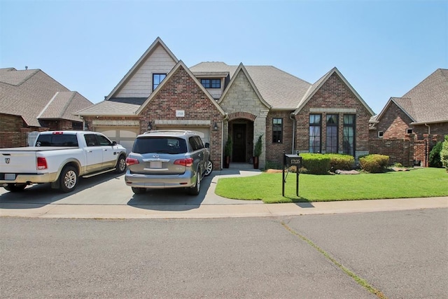 view of front facade with a garage and a front yard