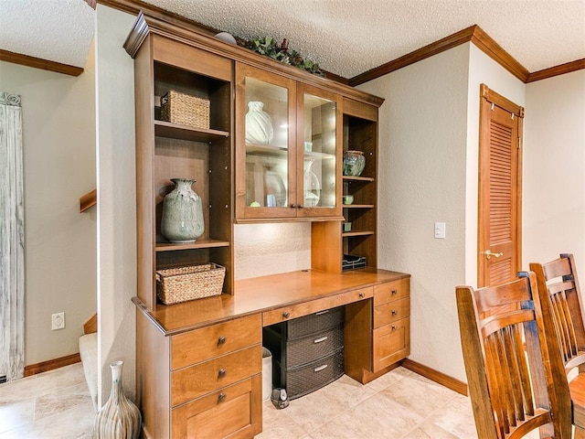 office with a textured ceiling and ornamental molding