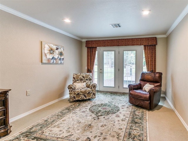 living area featuring carpet floors, crown molding, and french doors