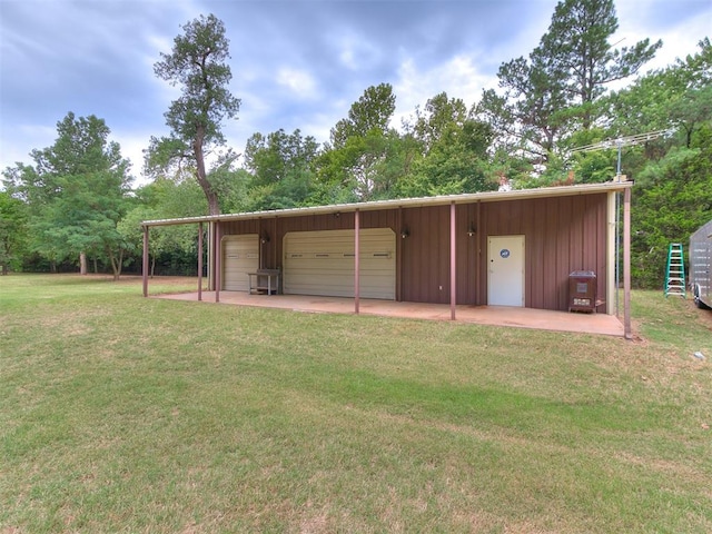 view of outbuilding featuring a lawn