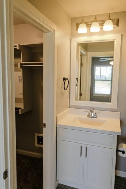 bathroom featuring vanity and ceiling fan