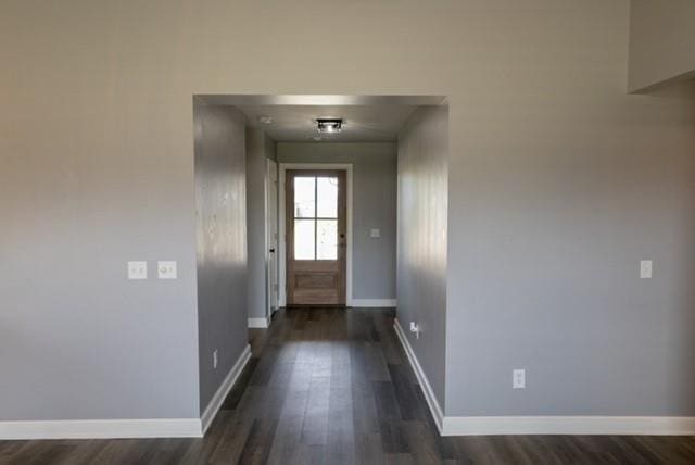 doorway featuring dark wood-type flooring