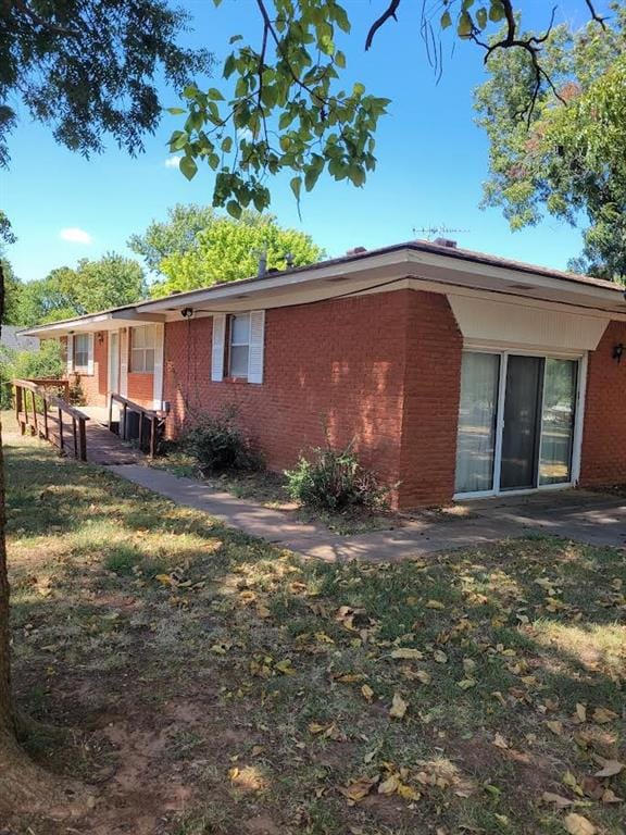 rear view of house with a yard