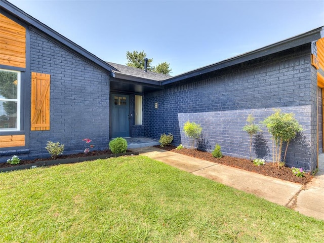 entrance to property with a yard