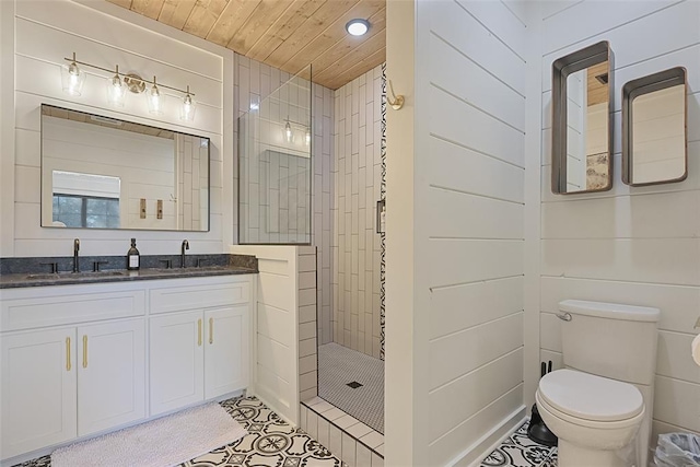 bathroom with vanity, wooden ceiling, tile patterned floors, toilet, and a tile shower