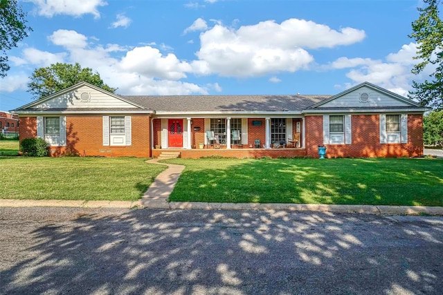 single story home featuring a porch and a front lawn