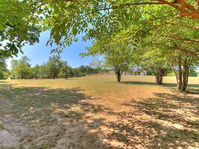 view of yard with a rural view