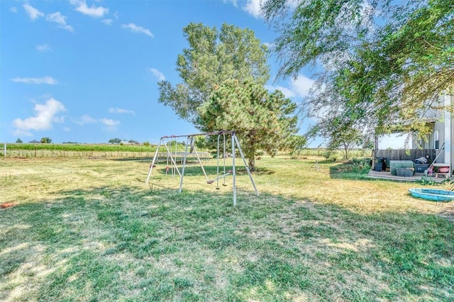 view of yard featuring a rural view and a playground