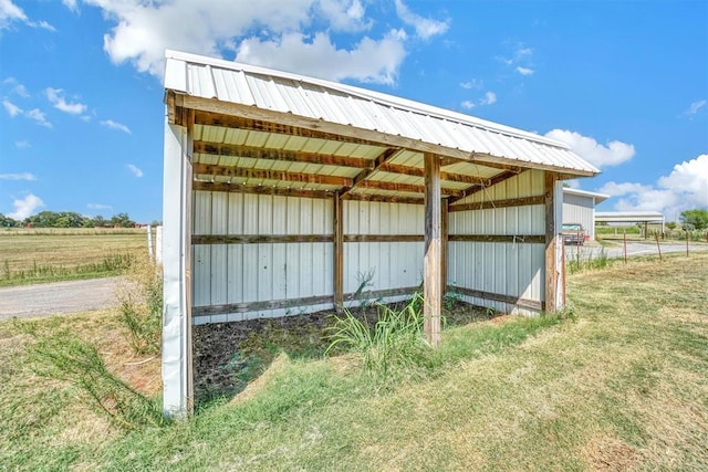 view of outbuilding with a rural view