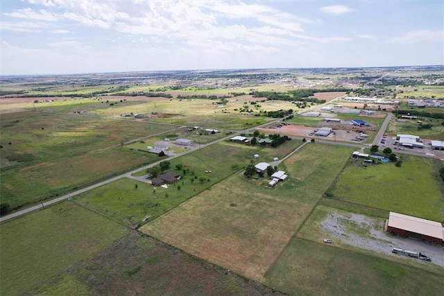 birds eye view of property with a rural view