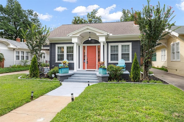 view of front of property with a front lawn