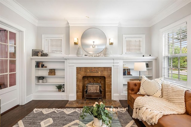 living area featuring a healthy amount of sunlight, crown molding, and dark wood-type flooring