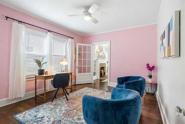 office featuring dark hardwood / wood-style floors, ceiling fan, and crown molding